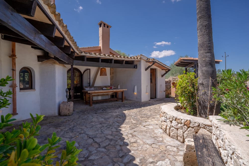 A covered outdoor table on the stone terrace, Hacienda Hermosa