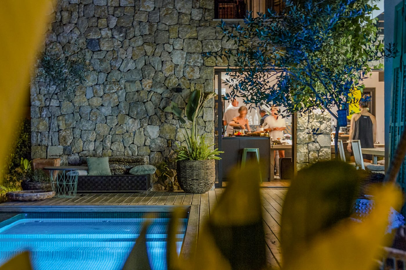 Casa Aguila exterior at dusk, lit from within