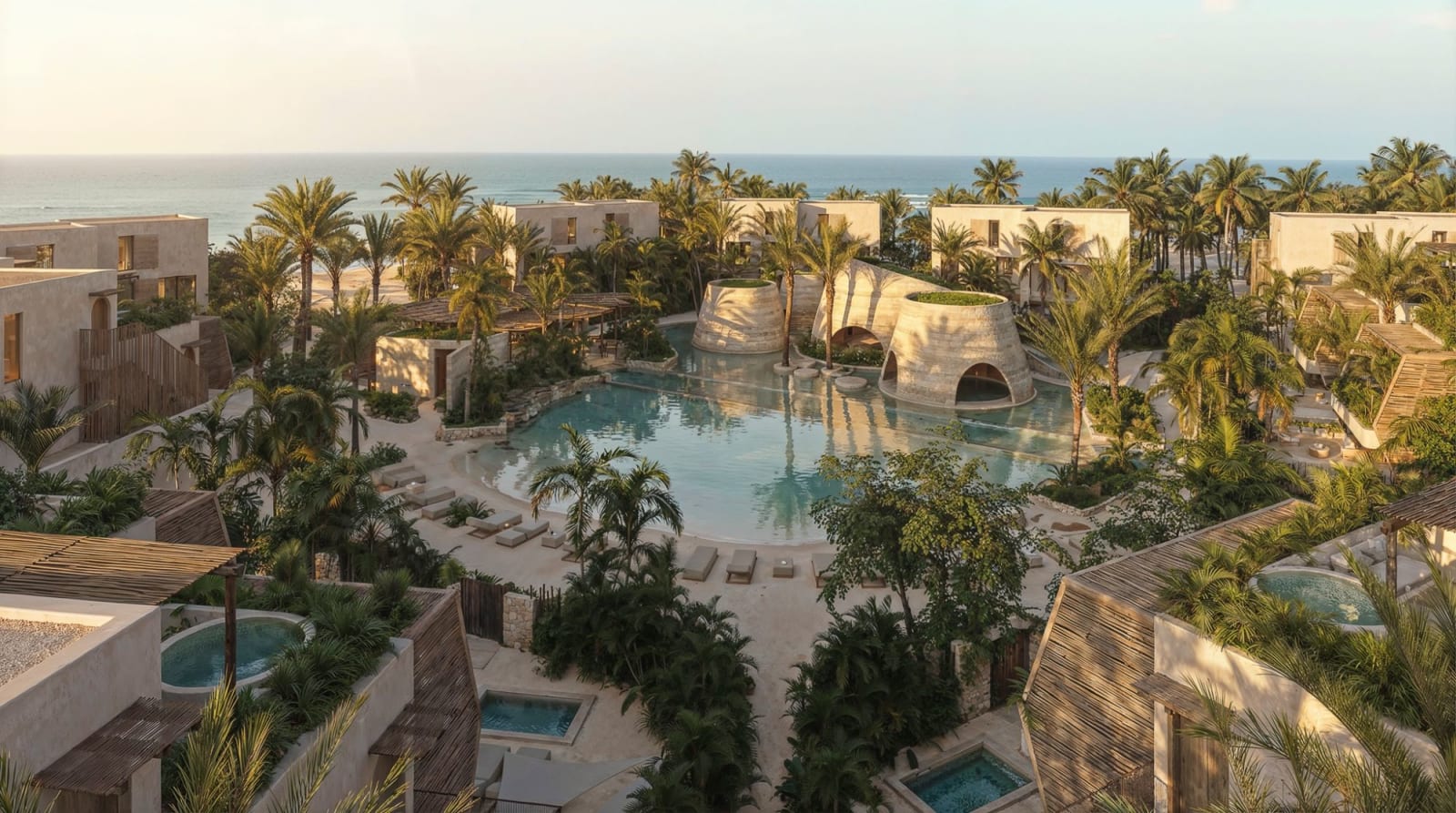 Amarse, Dominican Republic: low buildings around a lagoon pool among palm trees, facing the sea