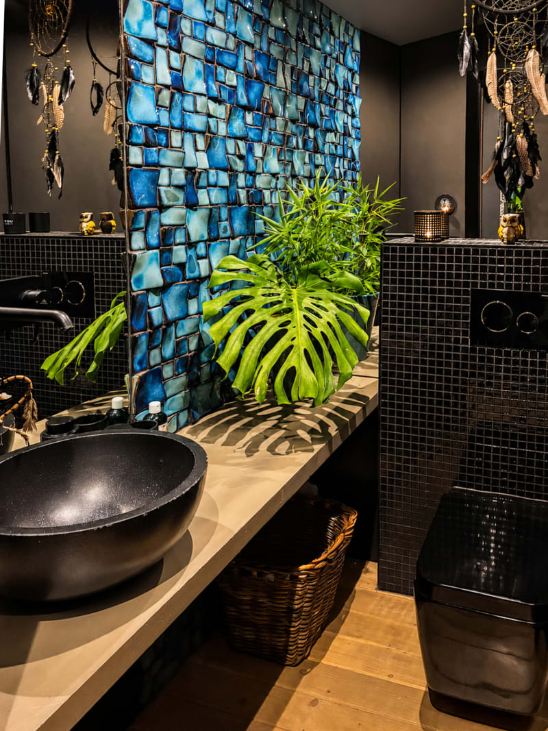 Powder room with blue glass mosaic wall
