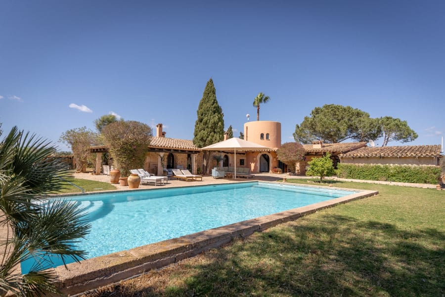 The saltwater pool in front of the stone house and its round tower, Hacienda Hermosa