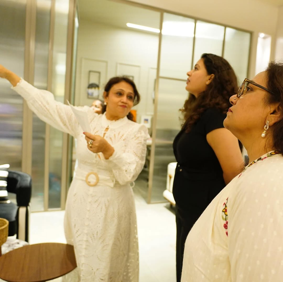 Curator speaking to a small group in gallery entrance