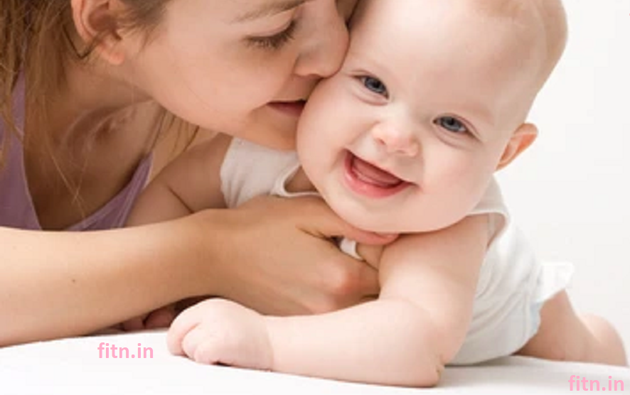 Mother holding cute baby with love