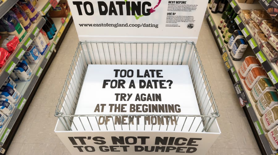 Messaging at the bottom of the empty food cage that reads “Too late for a date? Try again at the beginning of next month”.