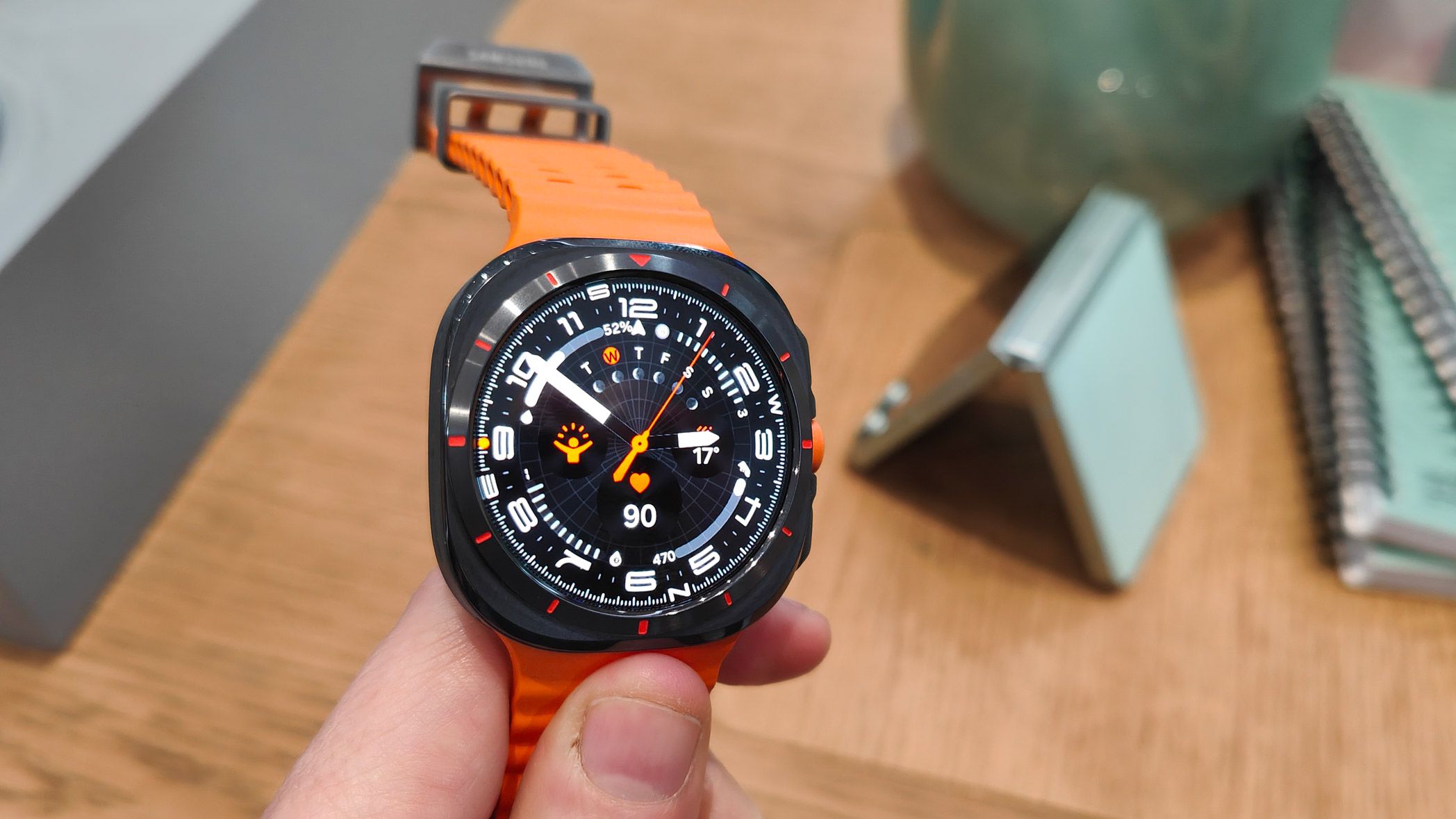 Samsung Galaxy Watch Ultra titanium design with orange Marine strap