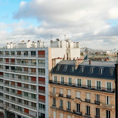 From the Patrick Hellmann Suite, the Eiffel Tower unfolds above the Golden Triangle rooftops.