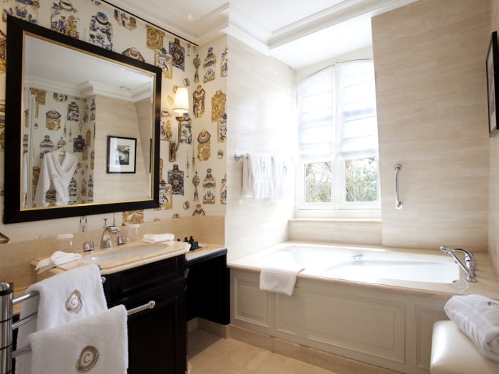 Elegant bathroom with refined details at Les Crayères Reims.