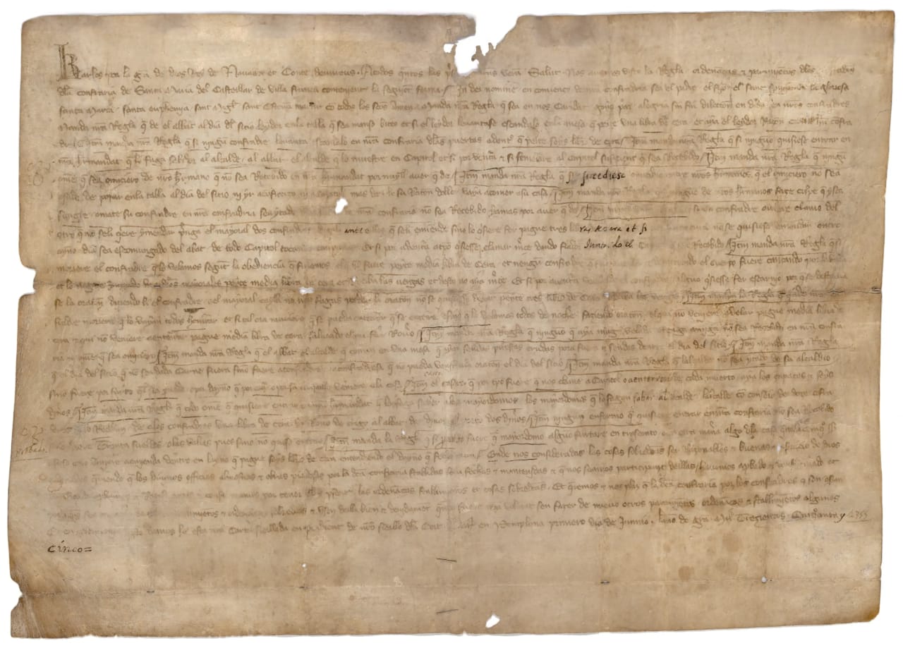 Documento histórico manuscrito en español sobre pergamino amarillento.