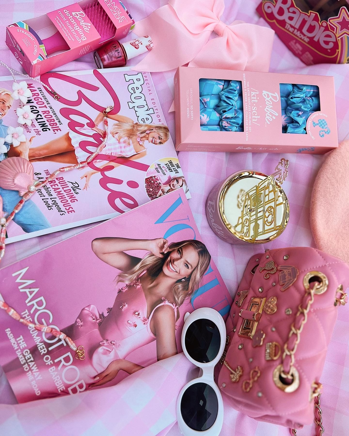 Flatly of Barbie products including Aldo x Barbie purse