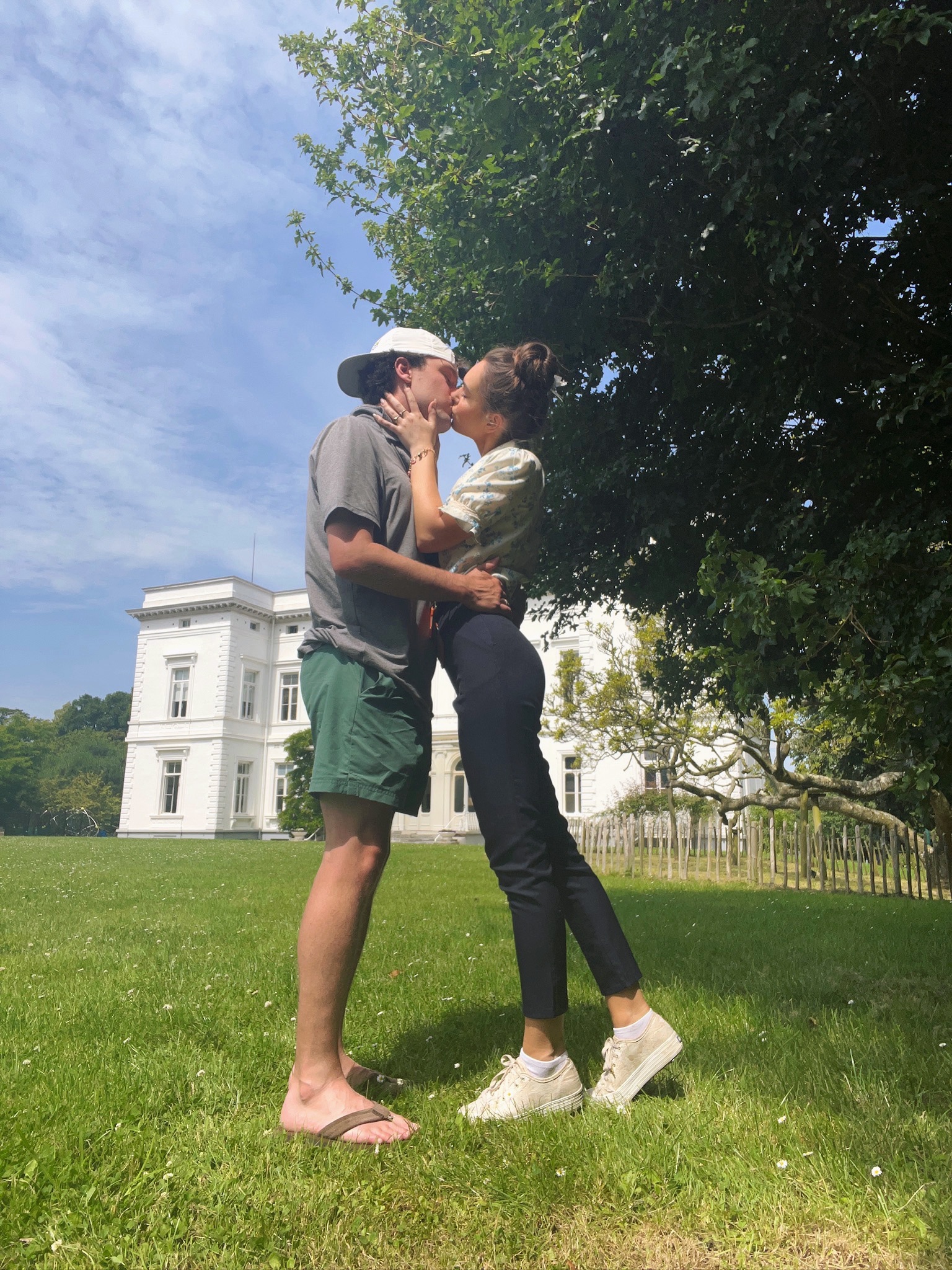 Couple kissing in front of ISB Chateau