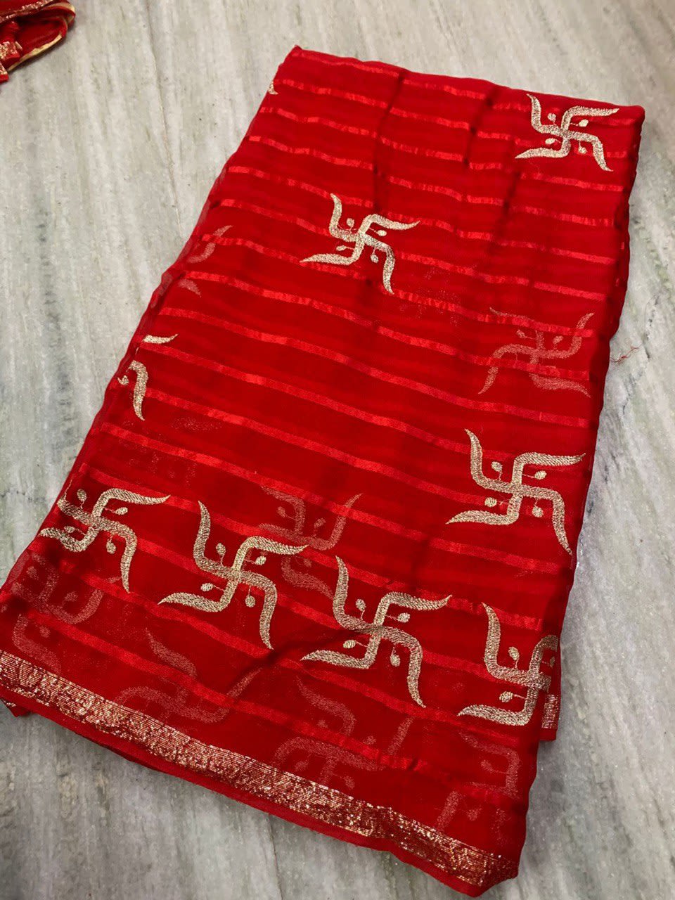 A Beautiful Swastik Design Pure Viscose Georgette Saree