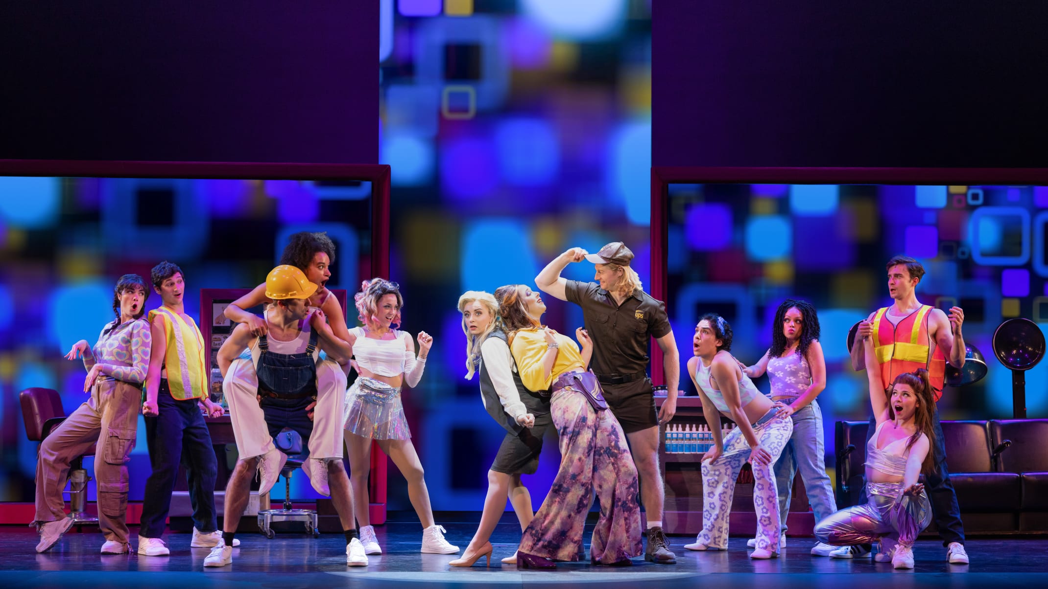 A large group of young adults dancing on stage.