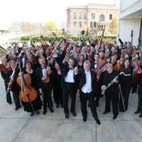 Des Moines Symphony standing outdoors for a photo