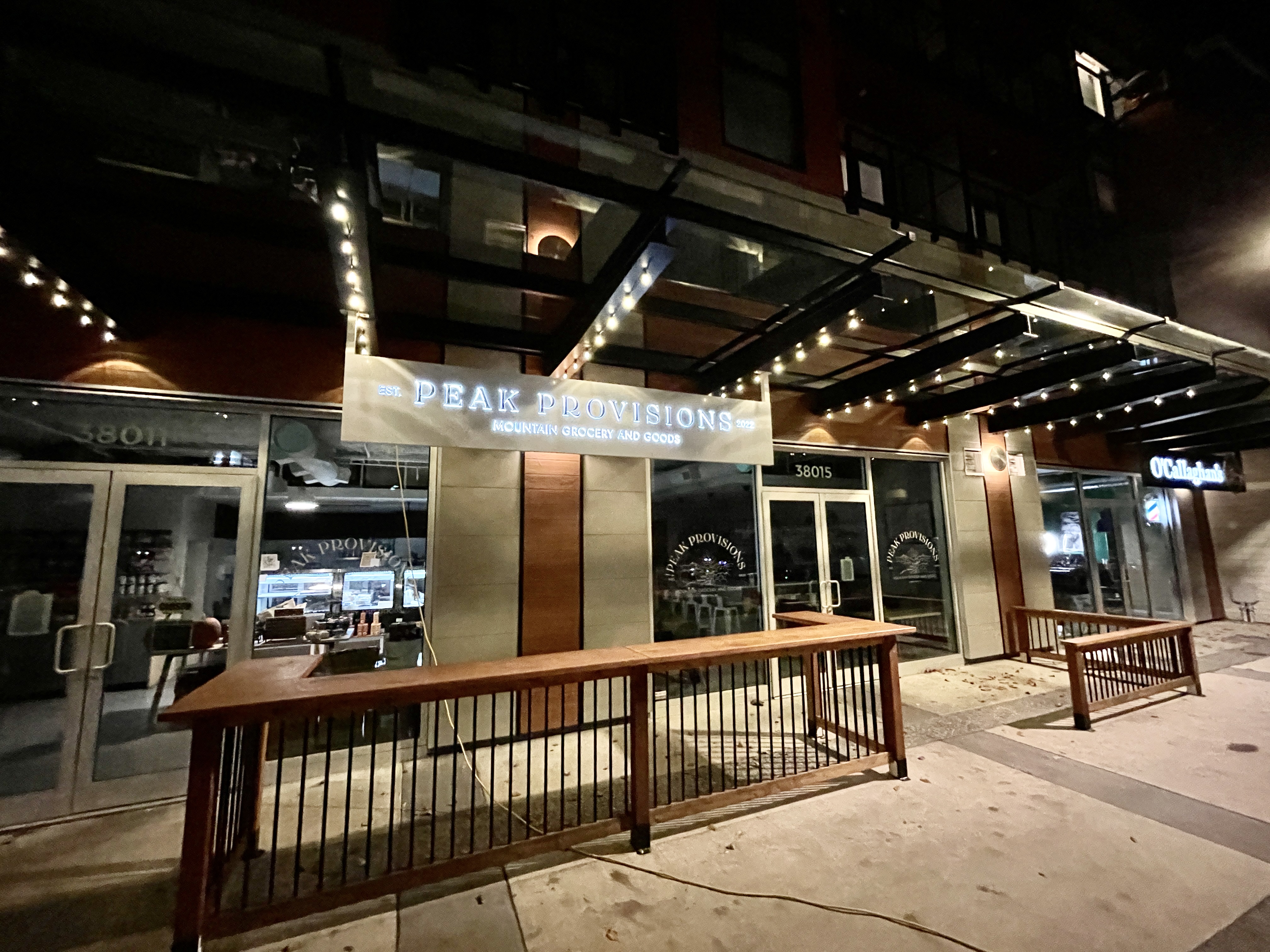 Peak Provisions restaurant with elegant white lights on its exterior.