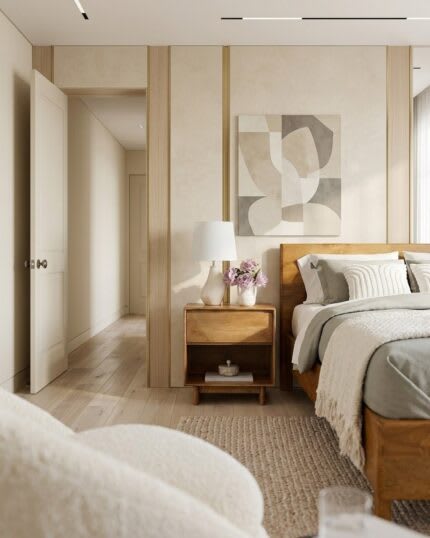 Modern bedroom with wooden bed, bedside table, and neutral decor in a cozy minimalist interior