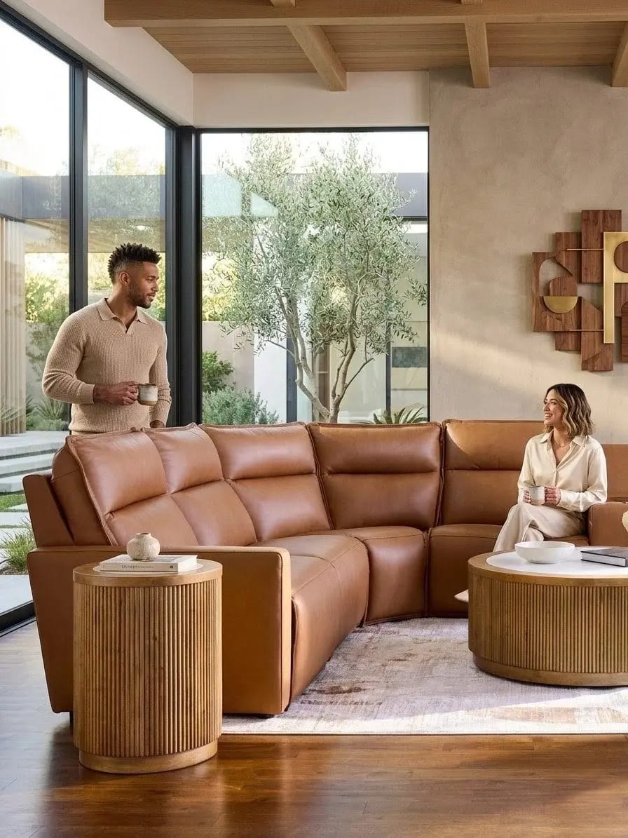 Modern brown leather sectional sofa in a luxury living room with large windows and natural light – stylish furniture for contemporary homes