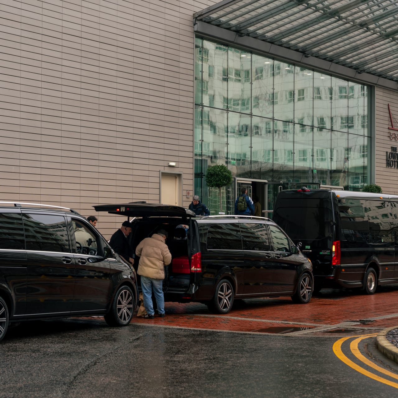 Cases going into a V-Class outside a hotel entrance
