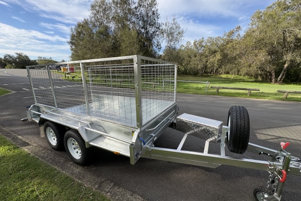 Cage trailer hire Bald Hills — 10x6 dual axle cage trailer with rear ramp