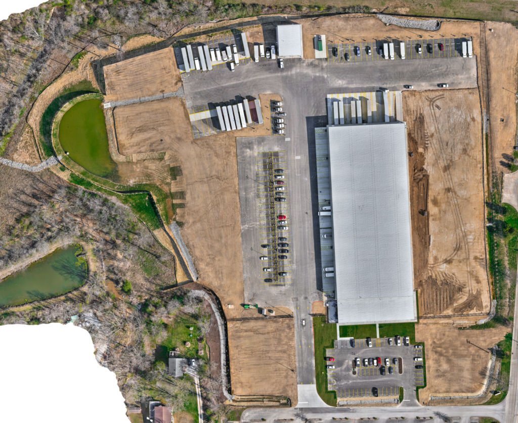 Aerial drone view of a large scale commercial construction site progress