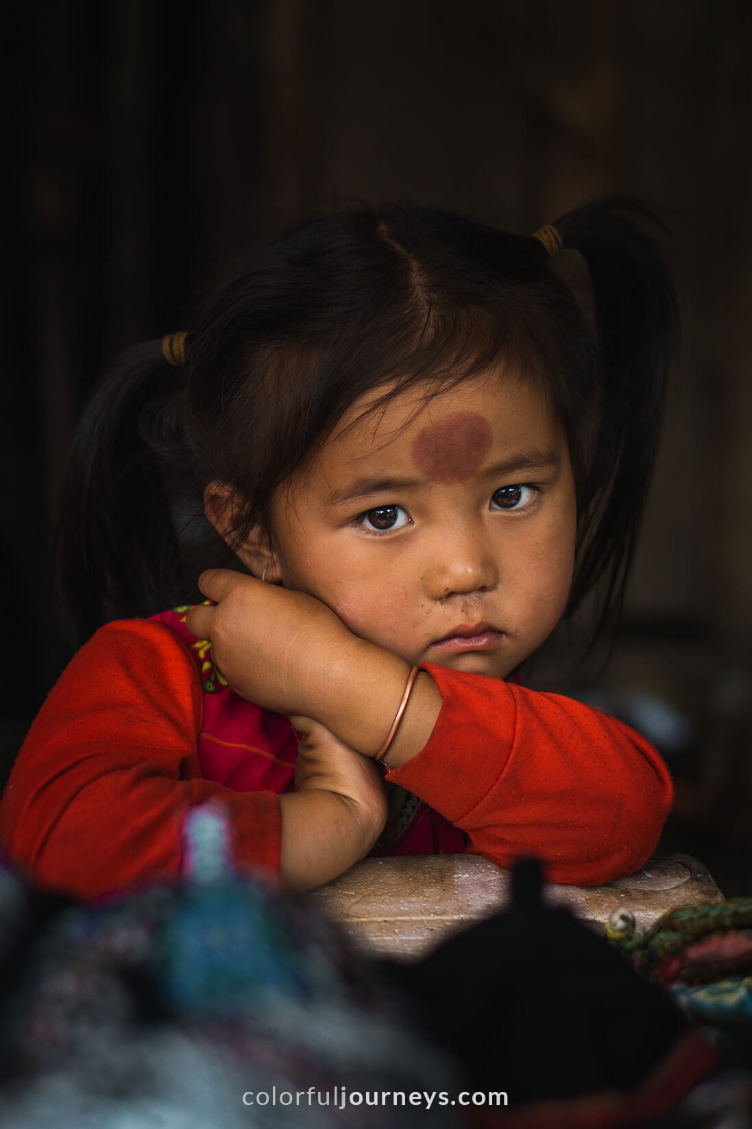 A young girl looks into the camera in Sapa, Vietnam