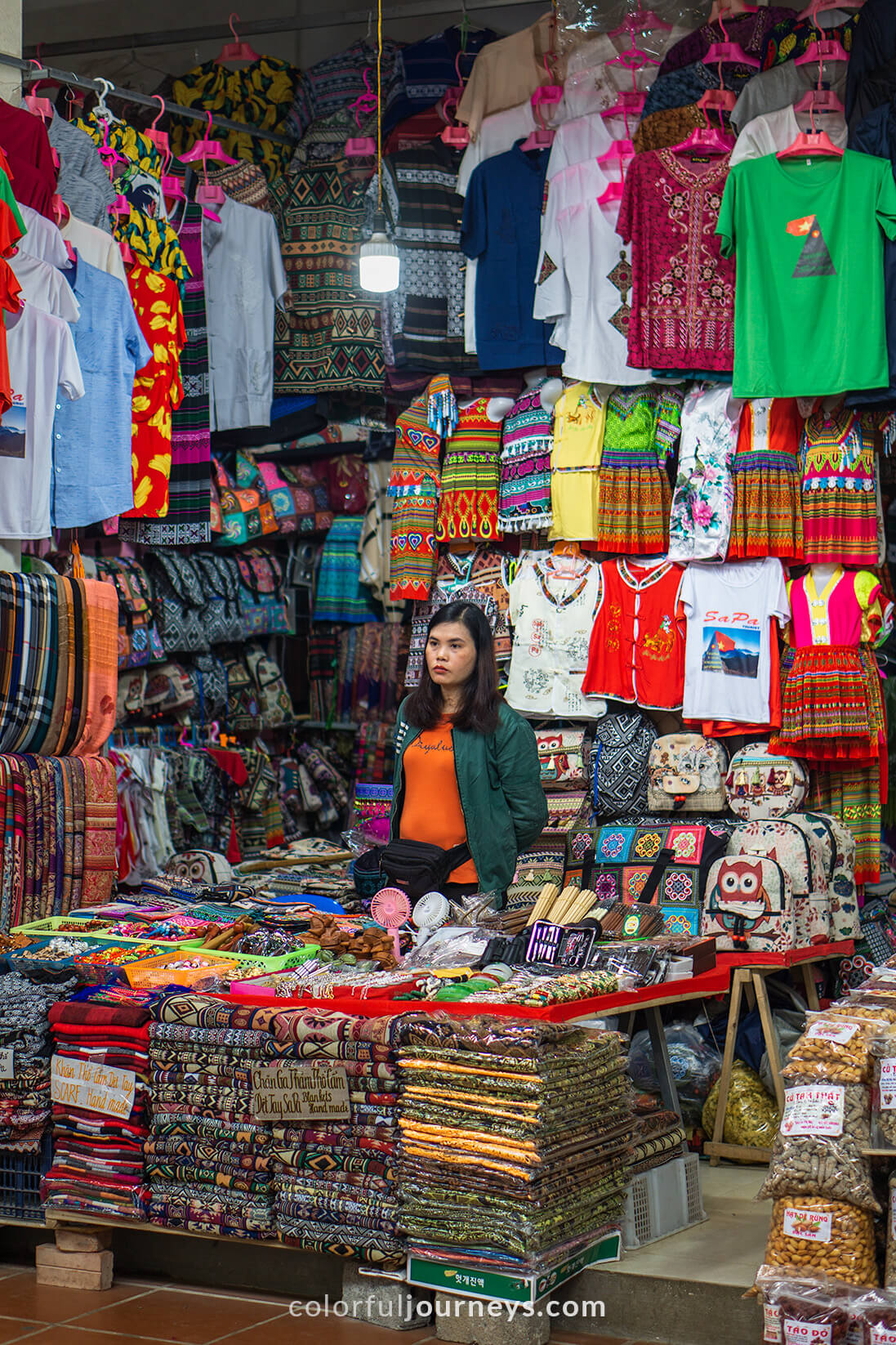 A vendor sells goods in Sapa Market.