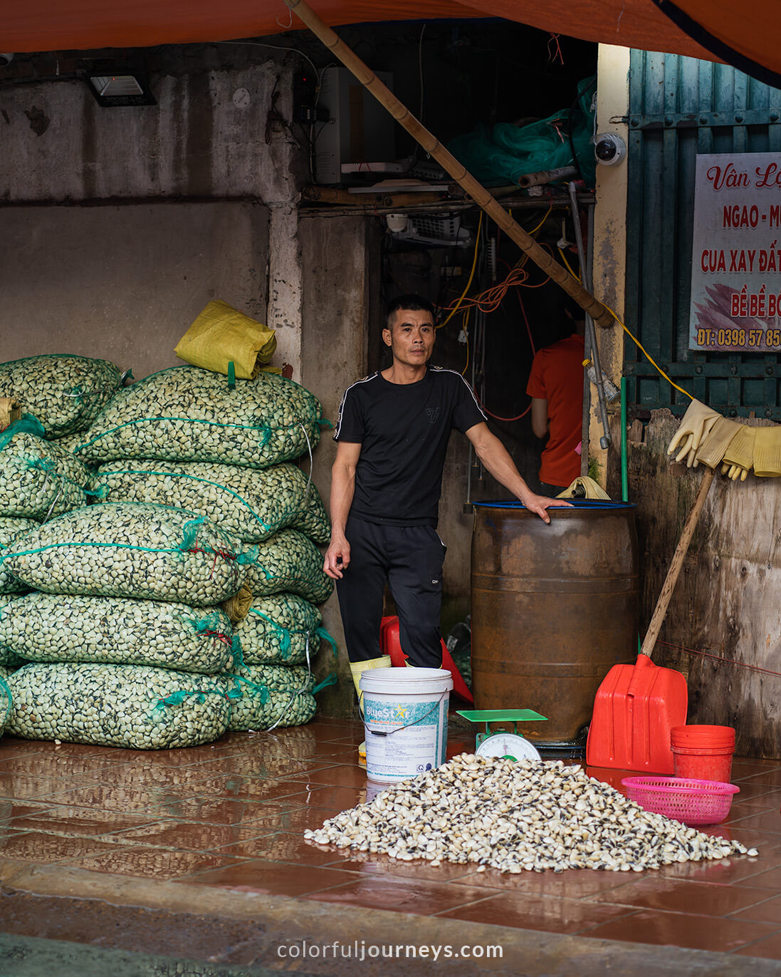 A man sells seafood in Hanoi, Vietnam.