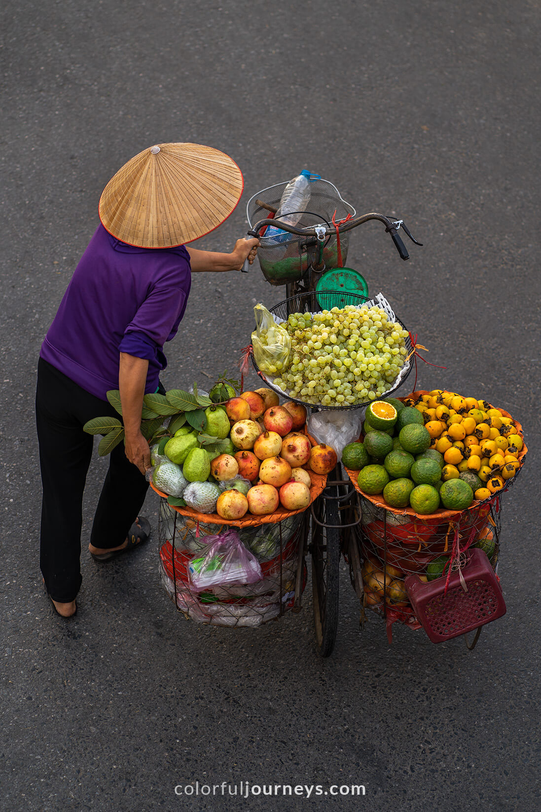 A vendor with a bicycle in Hanoi, Vietnam