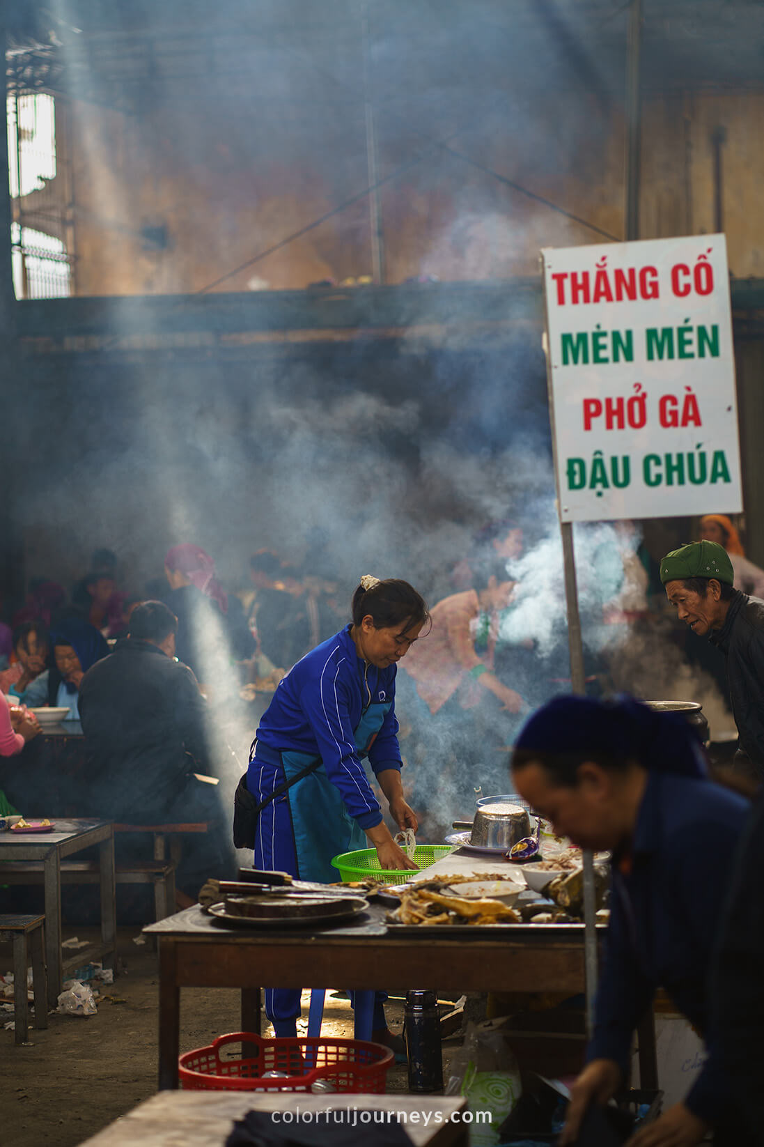 A woman sells noodles at Meo Vac Market, Vietnam