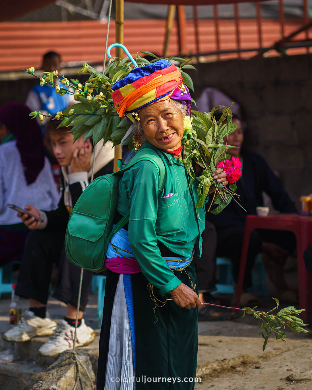 A woman smiles at the camera at Meo Vac Market, Vietnam