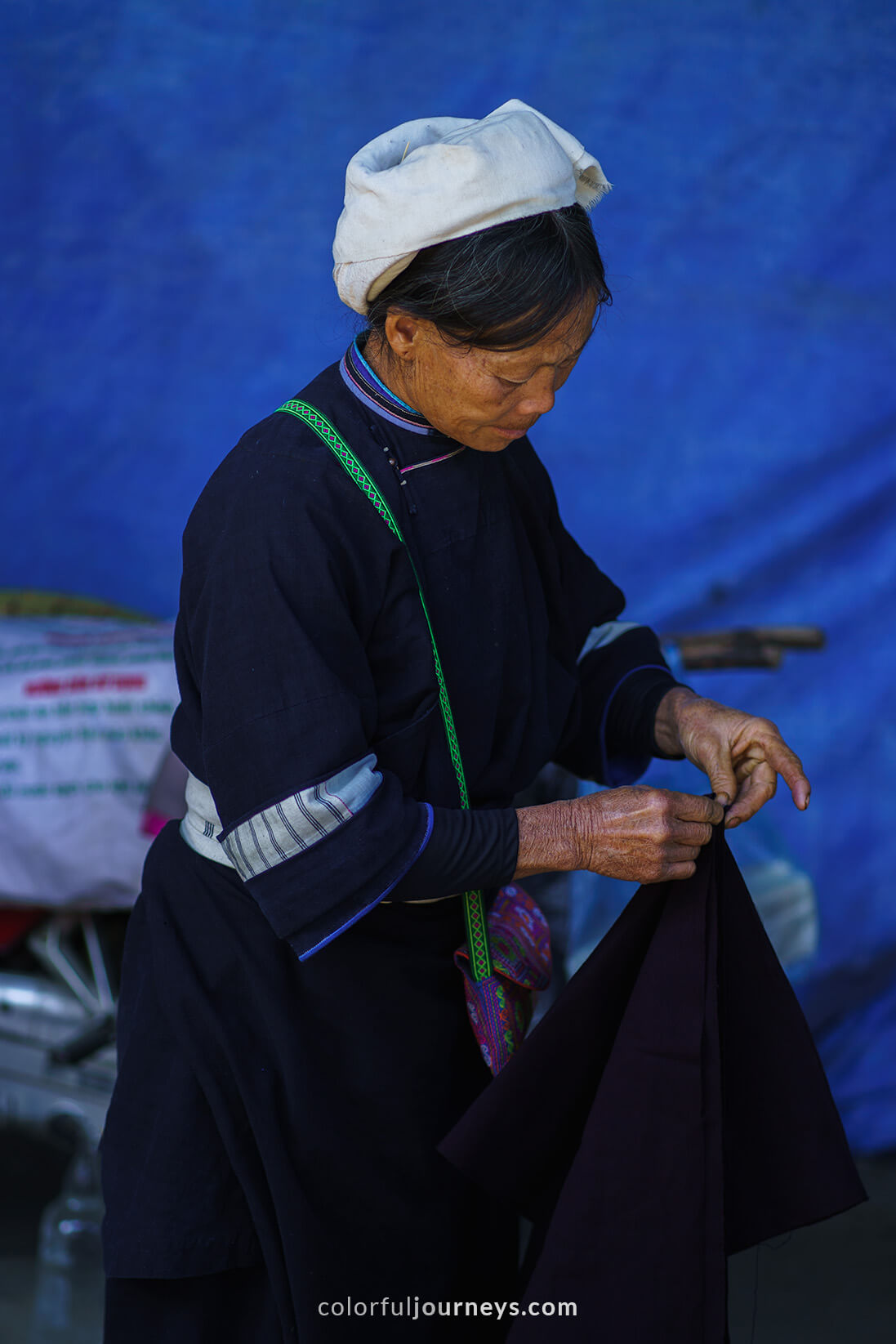 A woman sells textile at a market in Cao Bang, Vietnam