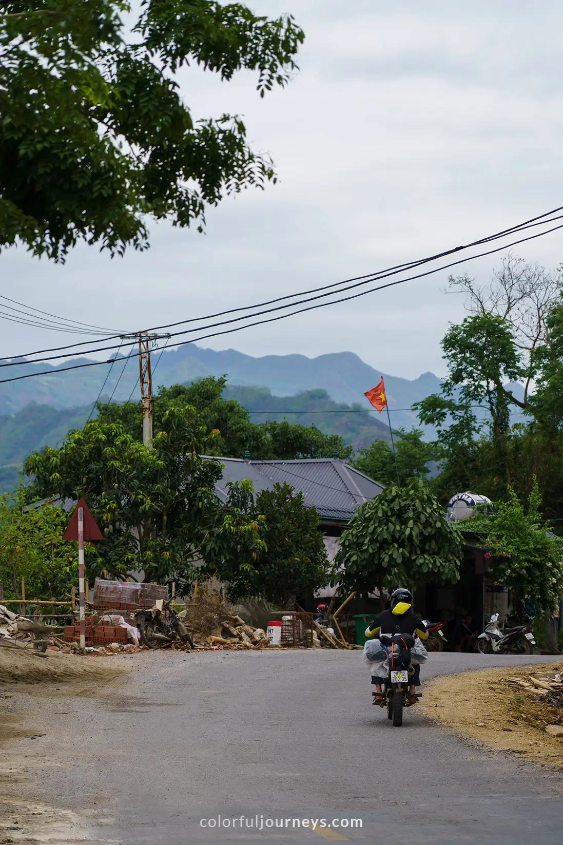 A motorbike drives on a mountain road in Vietnam