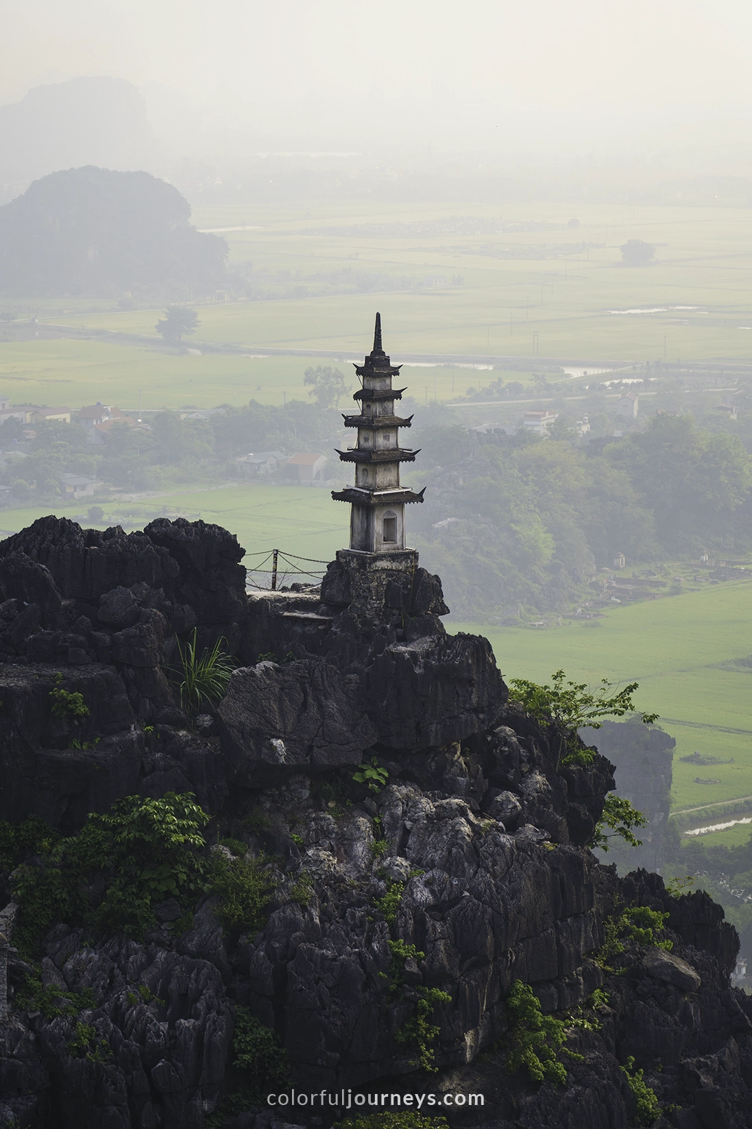 Stairs lead to a temple on top of a mountain in Ninh Binh, Vietnam