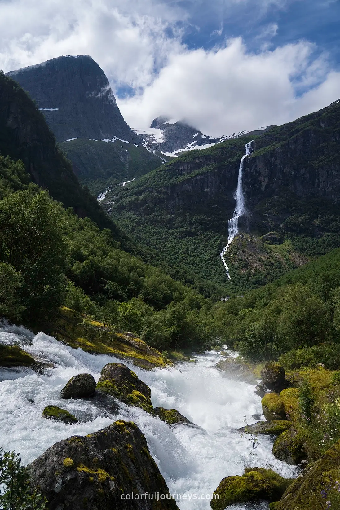 Kleivafossen waterfall with mountains in the background in Norway