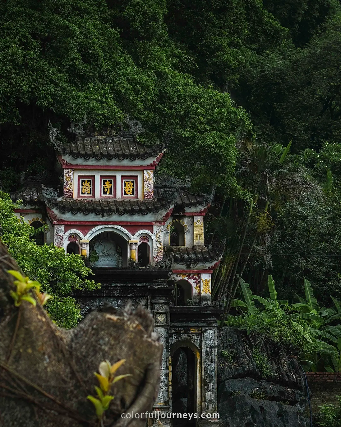 A temple surrounded by trees in Ninh Binh, Vietnam