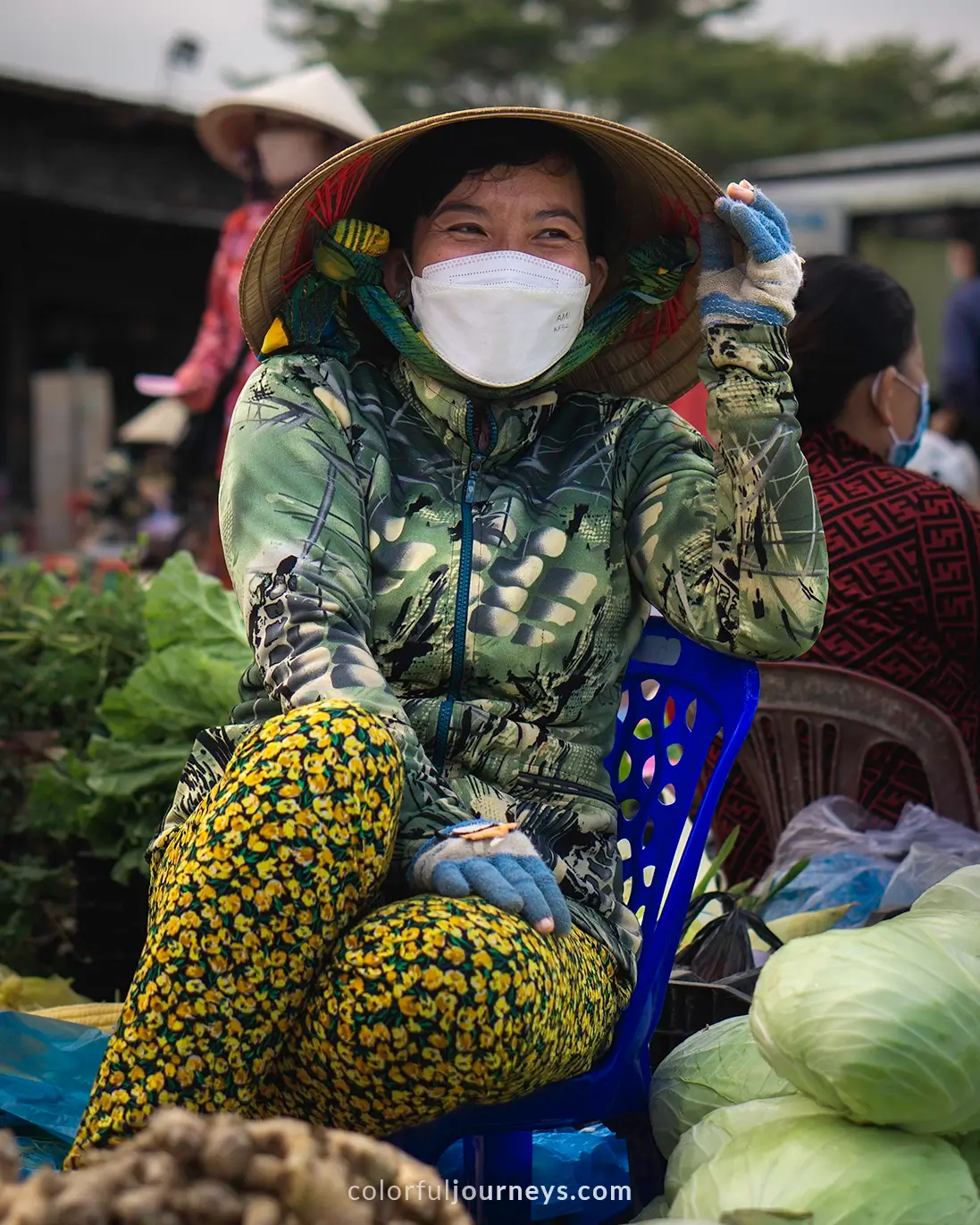 A woman selling goods at a market in Vietnam