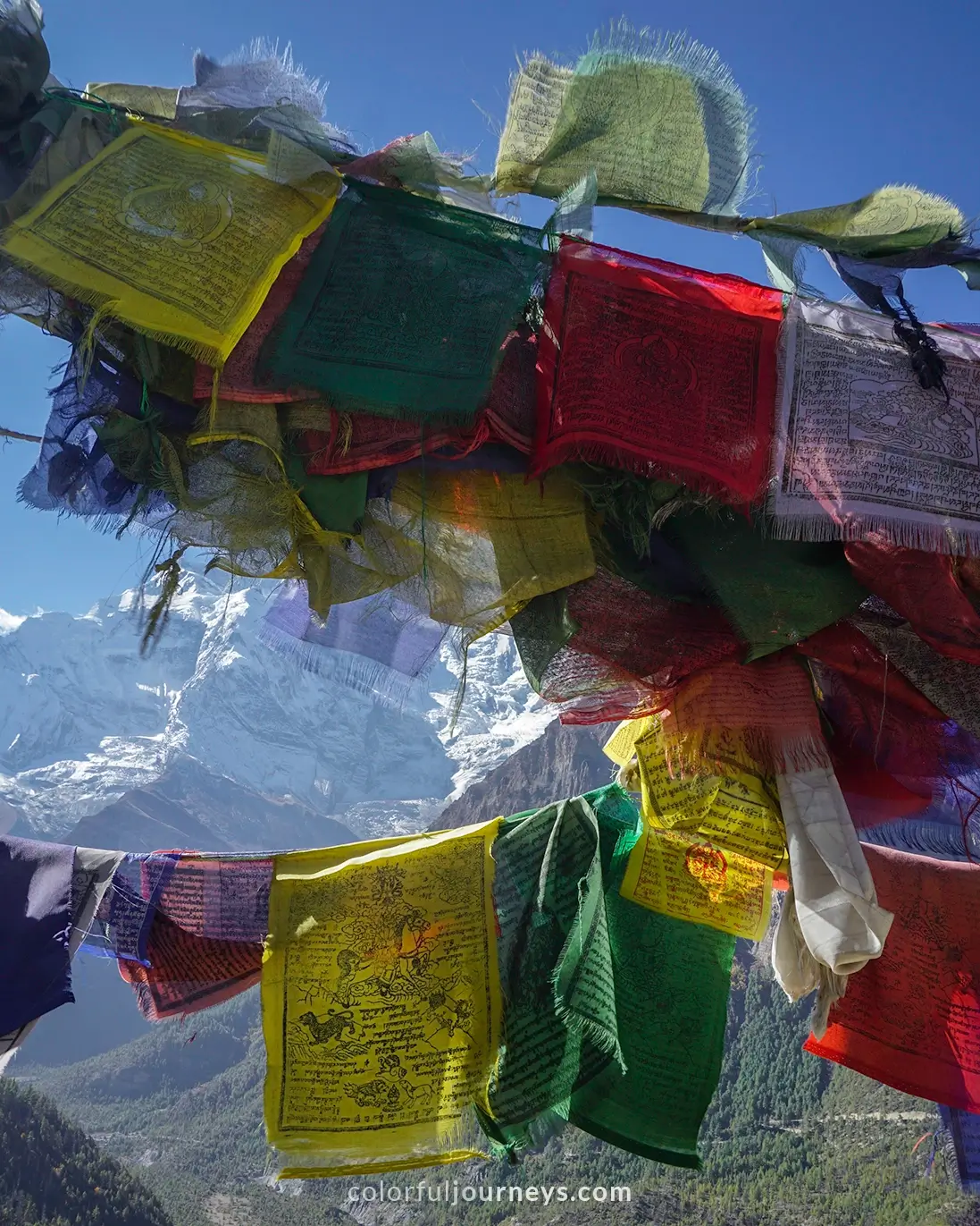 Prayer flags with mountains in the background in Nepal