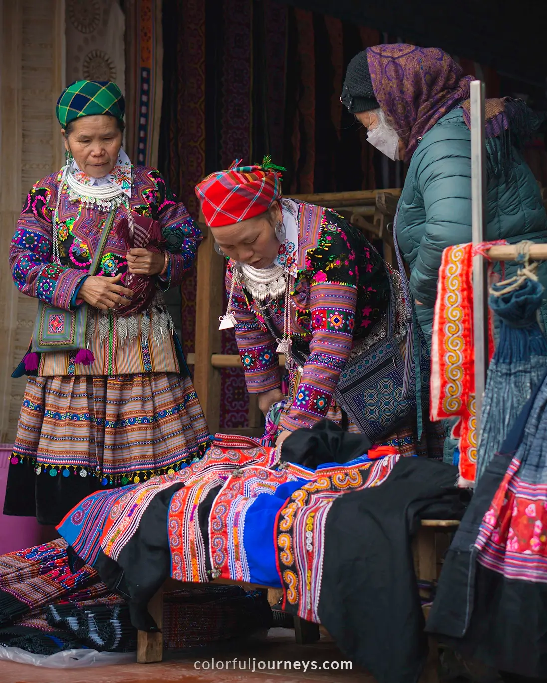 Women dressed in colorful traditional clothes at Bac Ha market