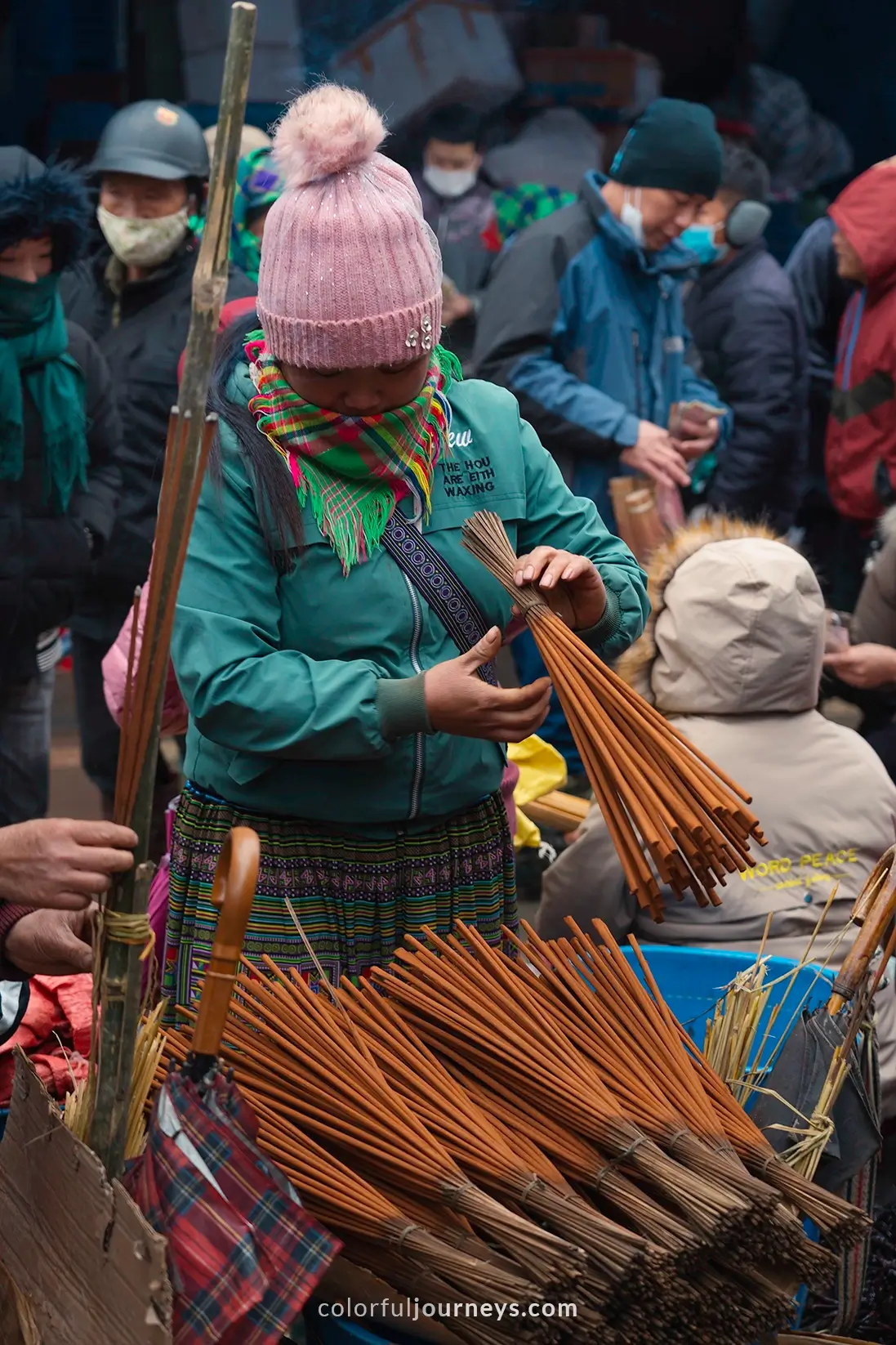 Women selling incense at Bac Ha market, Vietnam