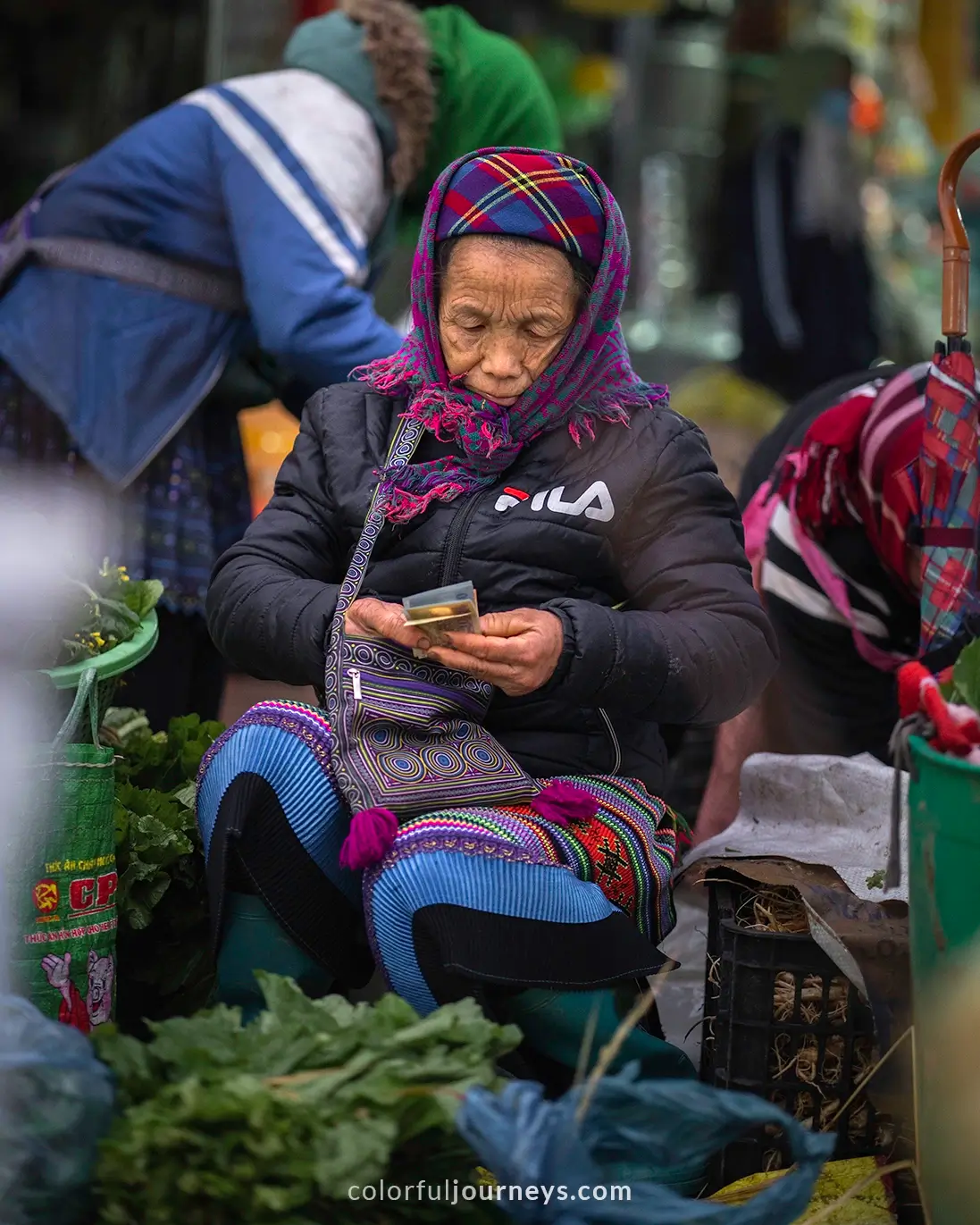 A woman sells fresh goods at Bac Ha market, Vietnam