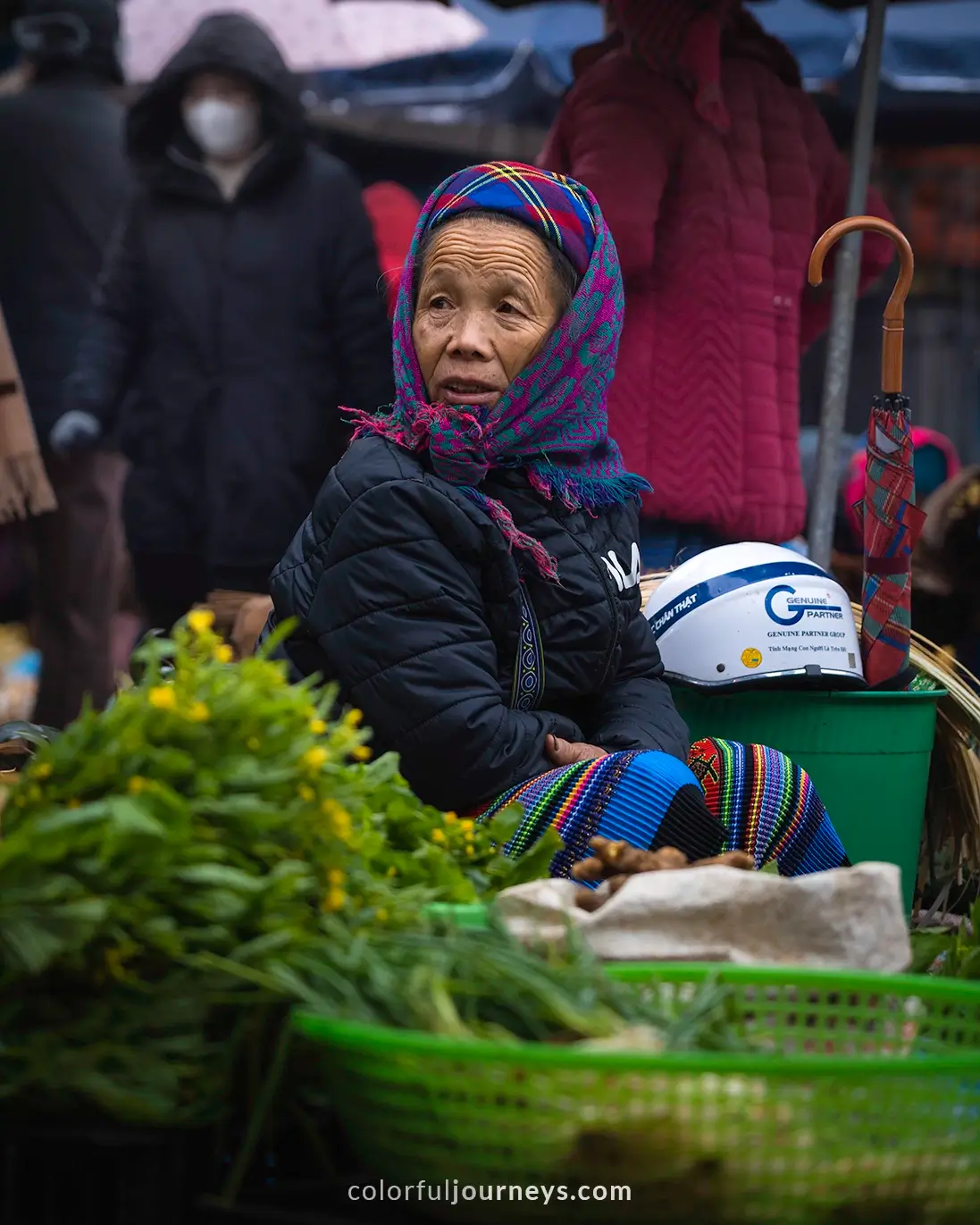 A woman sells goods at Bac Ha market, Vietnam