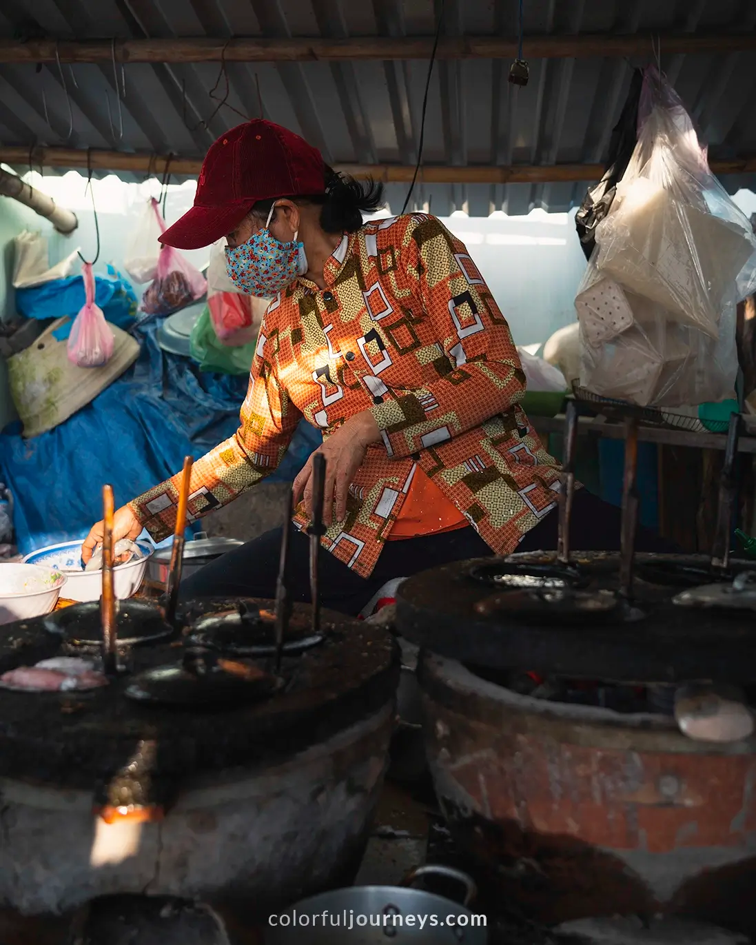 A woman is seen preparing Banh Xeo in Nhon Hai, Vietnam