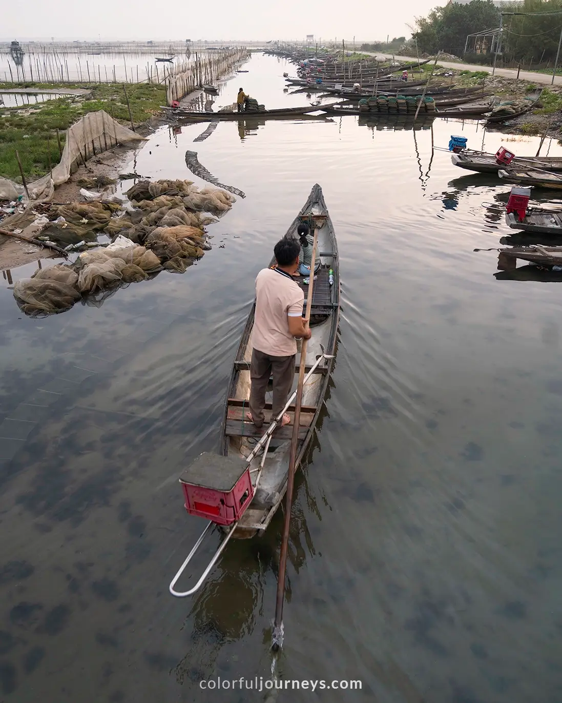 A man on a boat at Chuon Lagoon in Hue, Vietnam