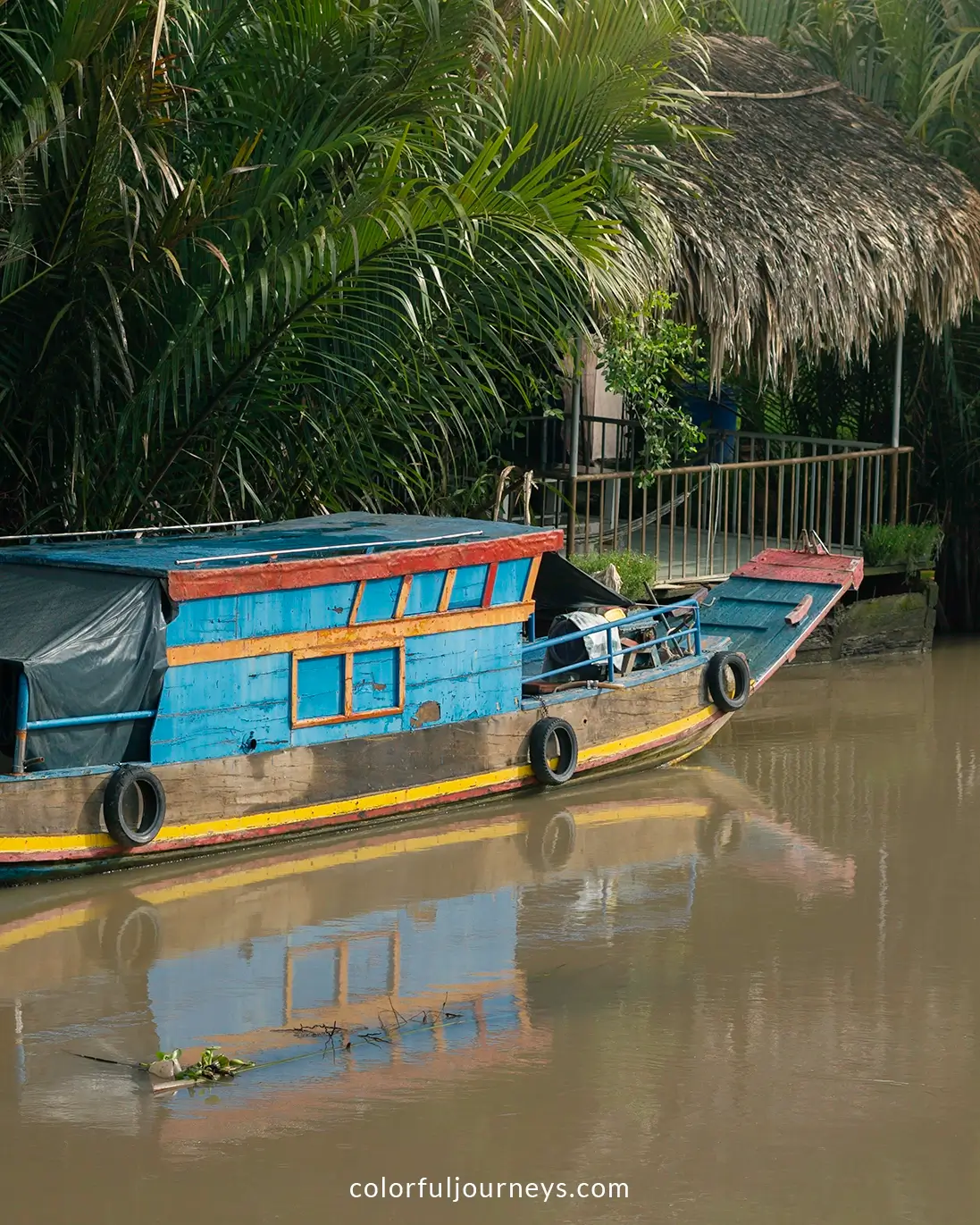 A colorful wooden boat in Ben Tre, Vietnam