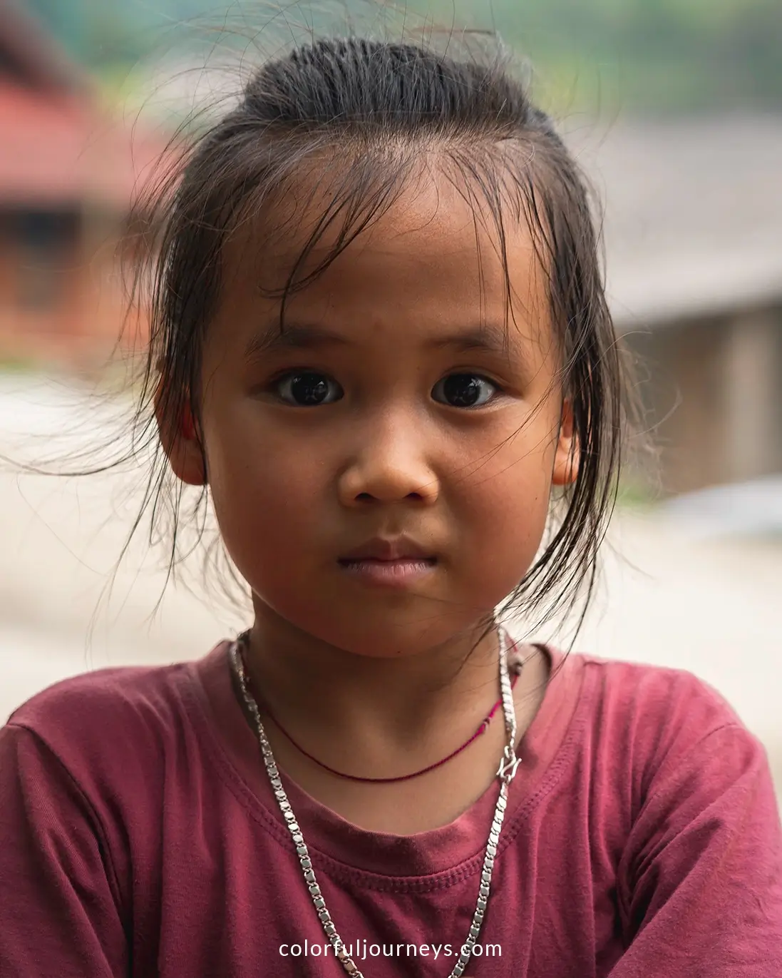 A girl looks at the camera in Pu Bin, Vietnam
