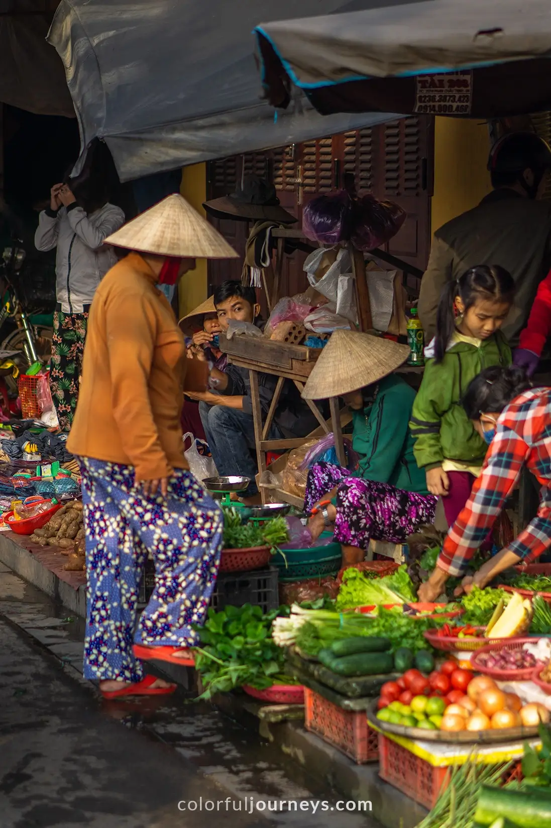 Women wearing a conical hat in Hoi An, Vietnam