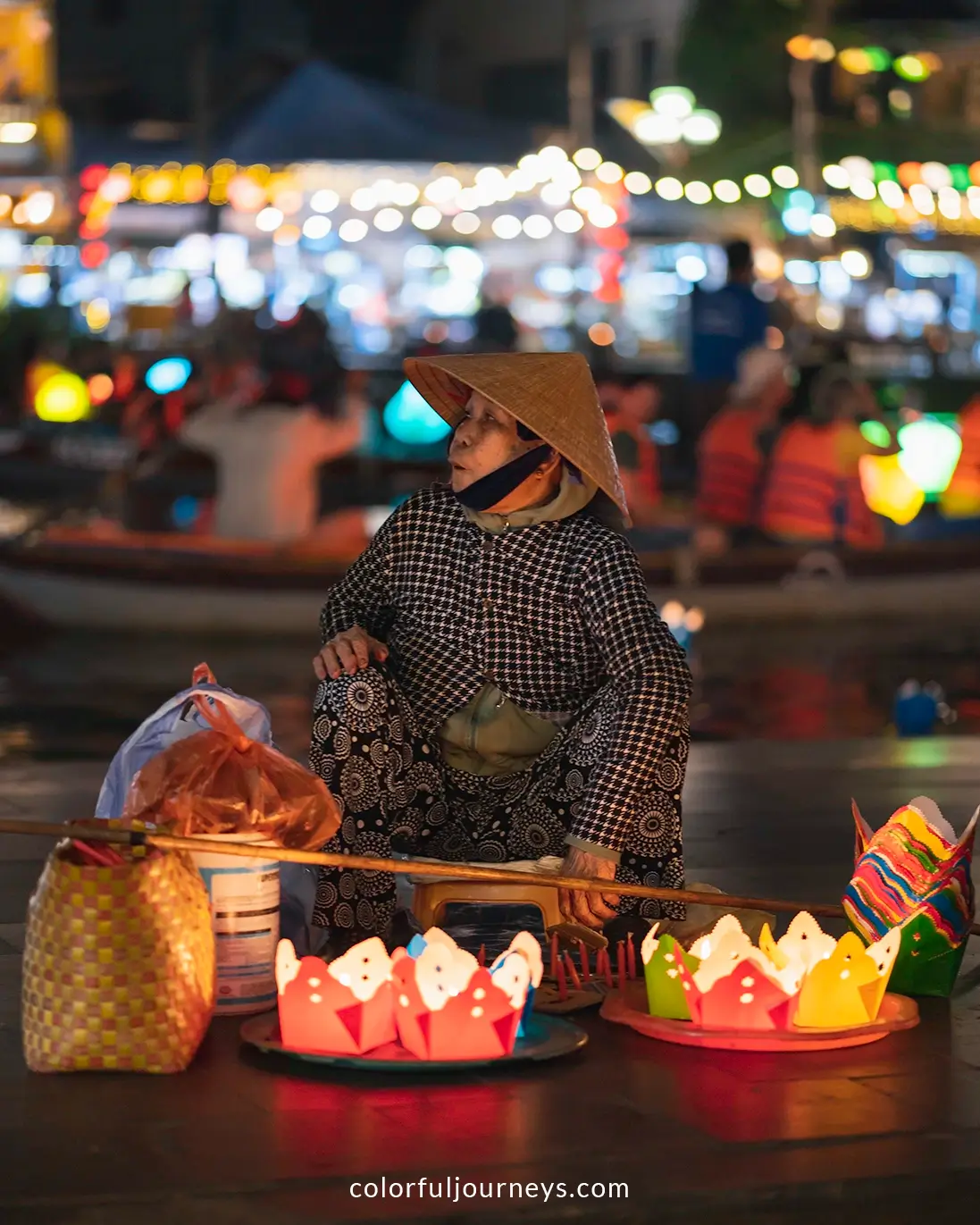 A woman selling lanterns in Hoi An, Vietnam