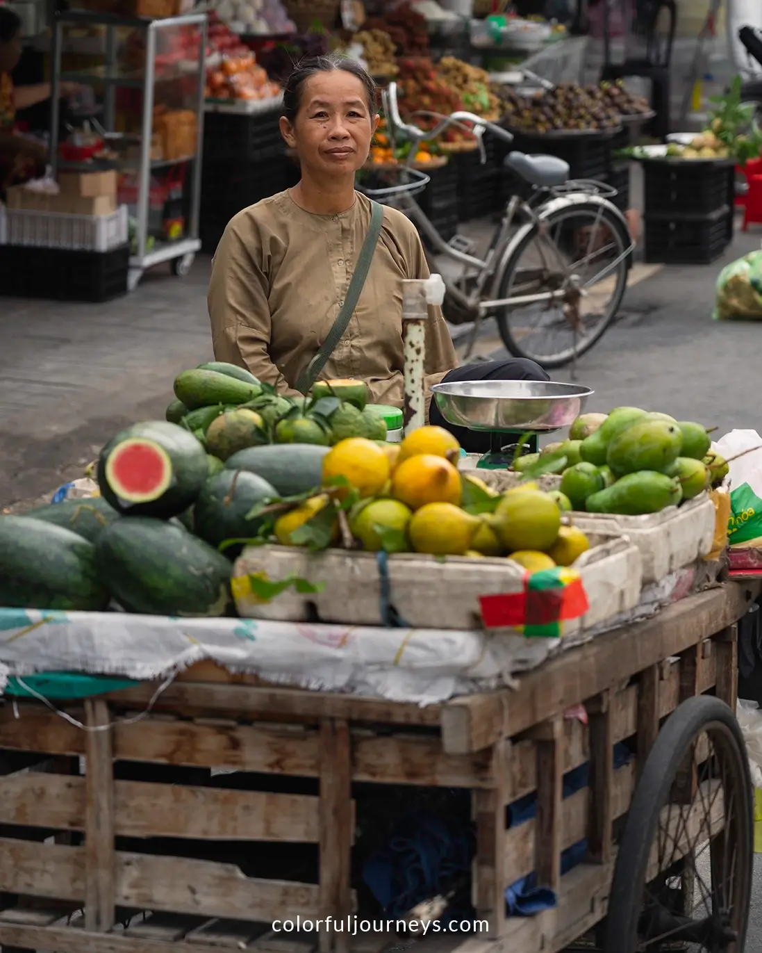 A woman sells fresh good at a market in Chau Doc, Vietnam