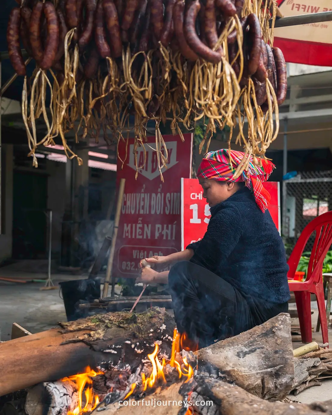 A woman cooks sausages in northern Vietnam