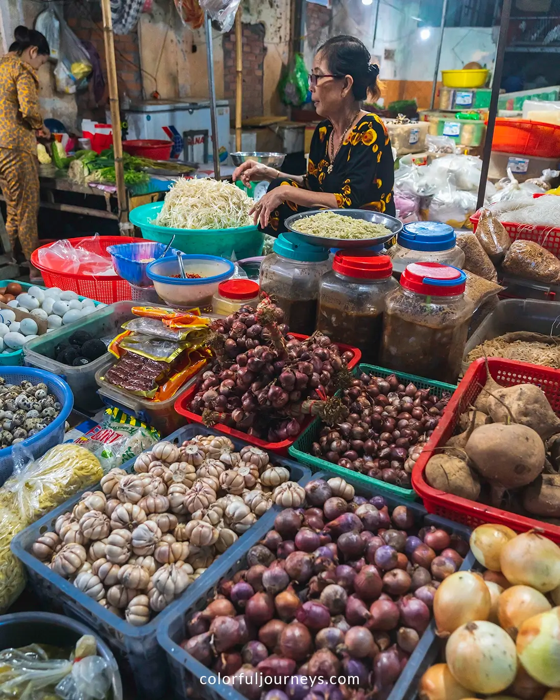A woman sells vegetables at a market on Hon Son Island, Vietnam