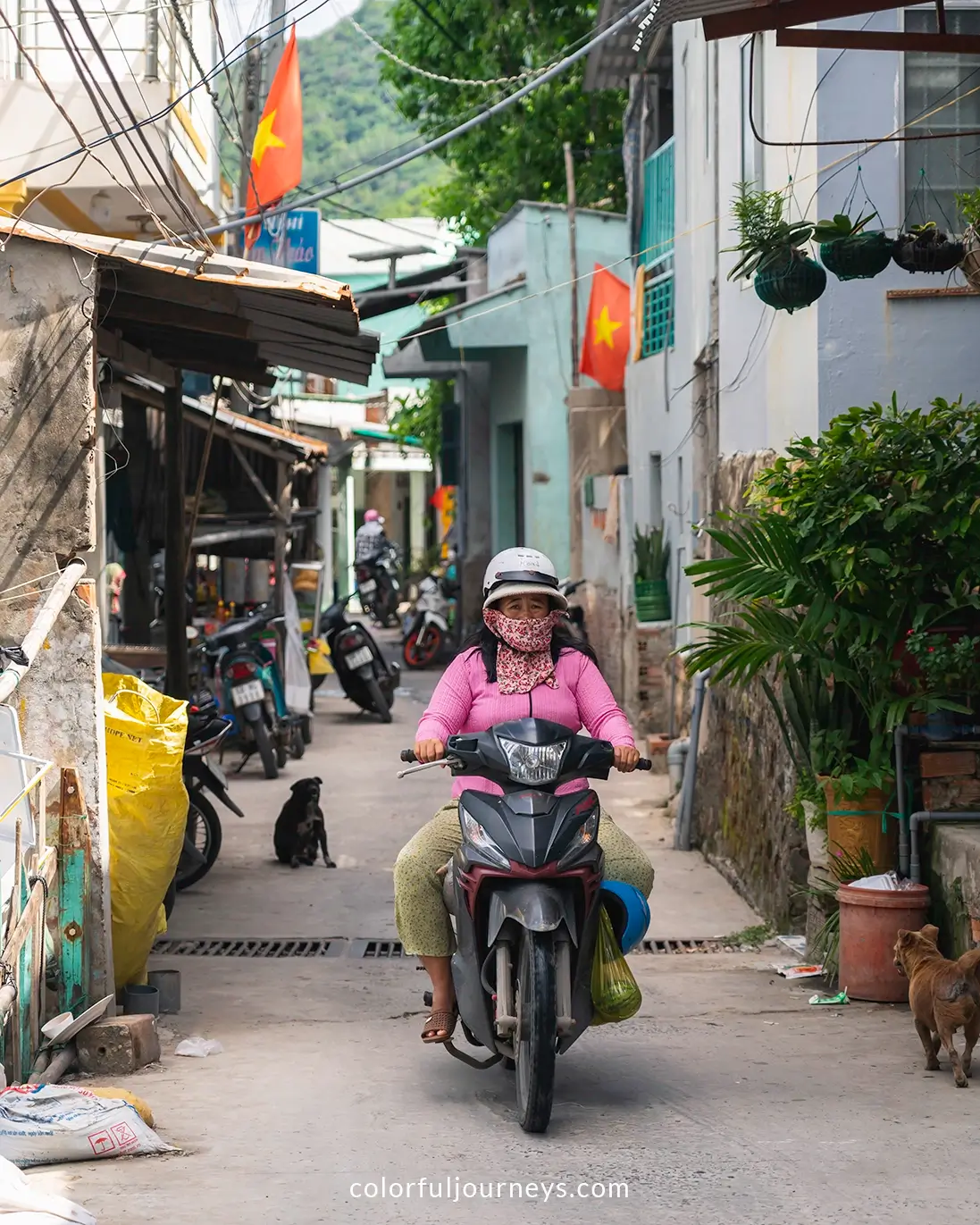 A woman rides a motorbike on Nam Du Island, Vietnam